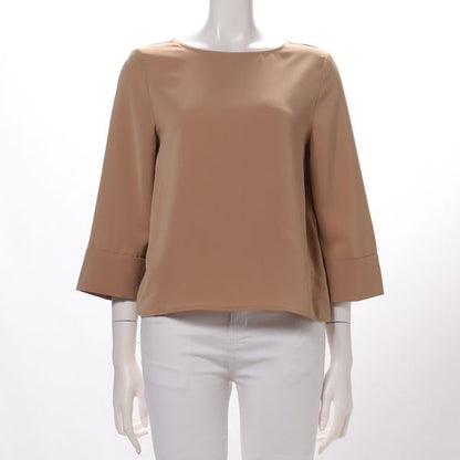 バックシルバーボタンブラウス