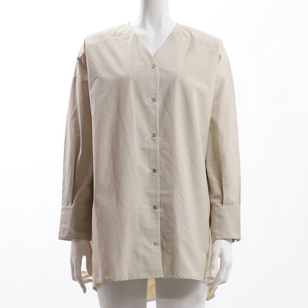 フロントボタンバックテールブラウス