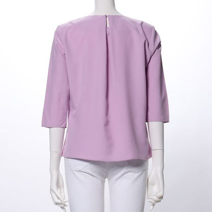 ペプラムデザインラウンドネックブラウス