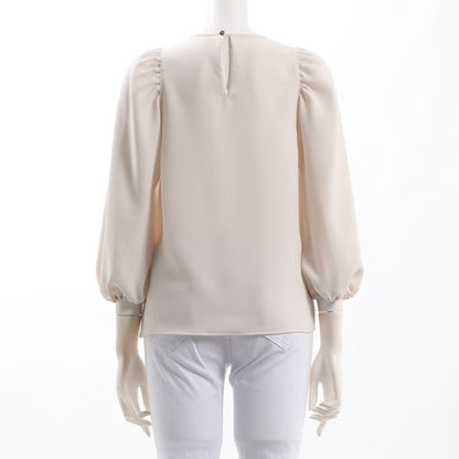 バックボタンデザインパフスリーブブラウス
