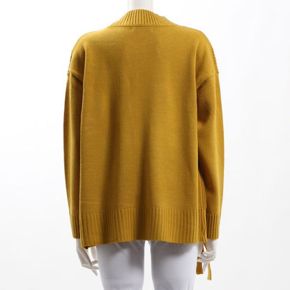 ラップ風ケーブル編みニット