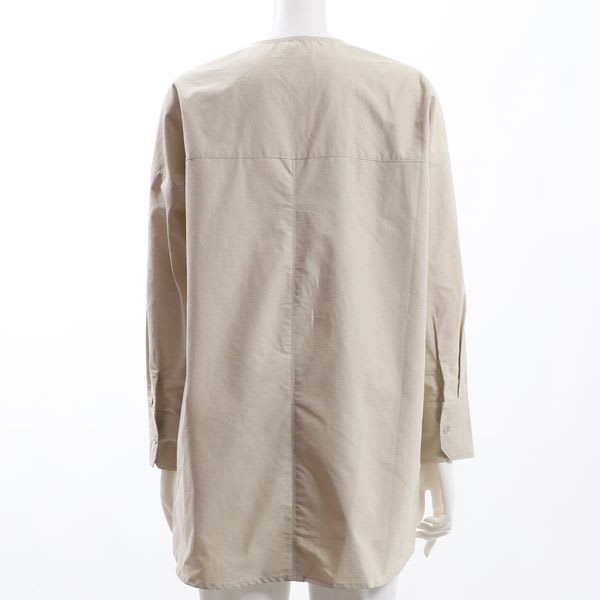 フロントボタンバックテールブラウス